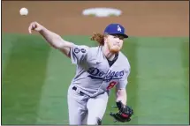  ??  ?? Los Angeles Dodgers pitcher Dustin May throws against the Oakland Athletics during the sixth inning of a baseball game in Oakland, California, on April 5. (AP)