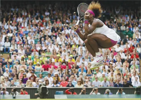  ?? (File Photo/AP/Anja Niedringha­us) ?? Serena Williams reacts June 30, 2012, after winning against Zheng Jie of China during a third round women’s singles match at the All England Lawn Tennis Championsh­ips at Wimbledon, England.