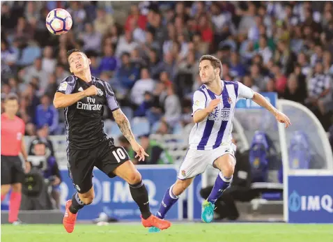  ?? — AFP ?? Real Madrid’s Colombian midfielder James Rodriguez (left) vies with Real Sociedad’s Joseba Zaldua during the Spanish league match in San Sebastian.