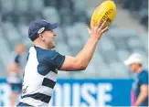  ?? Picture: ALISON WYND ?? PICK ME, SCOTTY: Gary Ablett tests his hamstring at training yesterday, but coach Chris Scott (right) is likely to leave the star on the sidelines for another week.