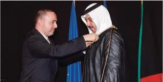  ??  ?? French Ambassador to Kuwait Christian Nakhla confers the ‘Chevalier de la Legion d’Honneur’ on Sheikh Mubarak Abdullah Al-Mubarak Al-Sabah.