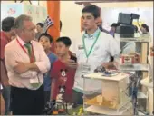  ?? PHOTOS PROVIDED TO CHINA DAILY ?? Left: Iason Stavros Somoglou (right), a student of the American Community School in Athens, explains a creative project to another participan­t at the seventh Shanghai Internatio­nal Youth Science & Technology Expo 2018 on July 21. Right: A “grid...