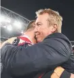  ??  ?? Roosters coach Trent Robinson celebrates with players.