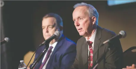  ?? DAX MELMER ?? Windsor-detroit Bridge Authority CEO Bryce Phillips, right, and Dwight Duncan, chair of the authority’s board of directors, provide an update on the Gordie Howe Internatio­nal Bridge project at Capitol Theatre on Thursday. Phillips says constructi­on has started on both sides of the border.