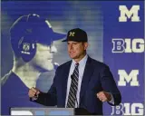  ?? CHARLES REX ARBOGAST / ASSOCIATED PRESS ?? Michigan coach Jim Harbaugh says his jab about controvers­y following Urban Meyer was neither new nor a “bombshell.”
