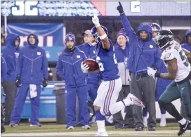  ?? JOHN BLAINE — FOR THE TRENTONIAN ?? Giants back Saquon Barkley celebrates as he scores a 68-yard touchdown against the Eagles during a Week 17game during the 2019season.