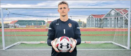  ?? JEREMY FRASER/CAPE BRETON POST ?? Ben Jackson, keeper for the Cape Breton Capers men’s soccer team, holds the ball after making a save prior to practice at the Cape Breton Health Recreation Complex on Thursday. The defending U Sports national champions will open the 2018 Atlantic University Sport regular season against the New Brunswick Reds on Saturday.