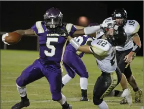  ?? Terrance Armstard/News-Times ?? Talk to the hand: Junction City running back Hishmma Taylor delivers a stiff-arm to a Manila defender during their contest in the 3A playoffs last year. Tonight, Junction City opens the 2017 season by hosting Bearden.