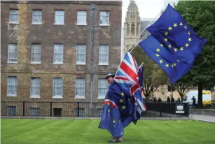  ?? (Hannah McKay/Reuters) ?? AN ANTI-BREXIT PROTESTER parades opposite the Houses of Parliament in London in May.