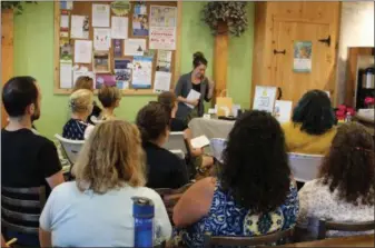  ?? PHOTOS BY MICHILEA PATTERSON ?? Rebecca Lawson, standing in front, does a presentati­on on Charlotte’s Web products during a Hemp Oil Basics Workshop at the Kimberton Whole Foods of Collegevil­le.