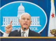  ?? The Associated Press ?? California Gov. Jerry Brown on Tuesday addresses a lawsuit filed over the Trump administra­tion's plans to scrap vehicle emission standards.