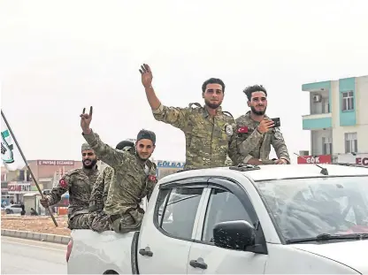  ?? Picture: Getty. ?? Members of the Turkish-backed Free Syrian Army near their base in Akcakale, Turkey.