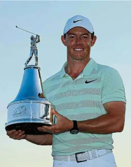  ??  ?? All smiles: Rory McIlroy posing with the trophy after winning the Arnold Palmer Invitation­al at Bay Hill in Florida on Sunday. — AFP