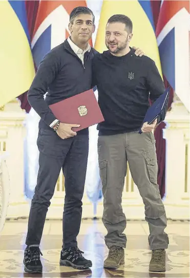  ?? ?? Rishi Sunak with Volodymyr Zelensky after signing an agreement following their meeting in Kyiv yesterday. The deal includes thousands of military drones, inset