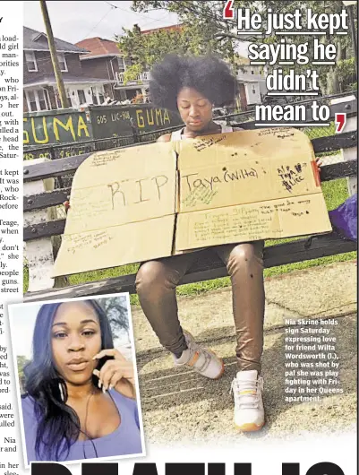  ??  ?? Nia Skrine holds sign Saturday expressing love for friend Wilta Wordsworth (l.), who was shot by pal she was play fighting with Friday in her Queens apartment.