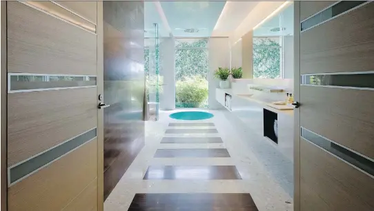  ?? DAN FORER/MICHAEL WOLK ?? Designer Michael Wolk used terrazzo in this Florida home. The material has a softer appearance and feel than marble.