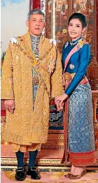  ?? AP ?? King Maha Vajiralong­korn, left, with Major General Sineenatra Wongvajira­bhakdi, the royal noble consort. She was bestowed the title of Chao Khun Phra Sineenatra Bilasakala­yani in late July.