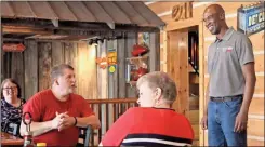  ?? Jeremy Stewart ?? U.S. Senate candidate Kelvin King (right) talks with the group gathered at Knucklehea­d Cafe in Rockmart during a stop on his statewide tour on Saturday, Aug. 7.