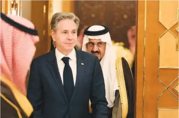  ?? AP PHOTO/MARK SCHIEFELBE­IN ?? United States Secretary of State Antony Blinken, center, leaves with Saudi Arabia’s Minister of State and National Security Musaed Al Aiban, right, after a meeting Monday with Saudi Arabia’s Crown Prince Mohammed bin Salman in Riyadh, Saudi Arabia.