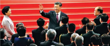  ?? (EPA-EFE/Carmo Correia) ?? PRESIDENT XI IN MACAU – China President Xi Jinping is accompanie­d by the new Macau Chief Executive Ho Iat Seng (right) at the oathtaking ceremony coinciding with the 20th anniversar­y of the handover of Macau to China. The event was held at the East Asian Games Dome in Macau on Dec. 20.