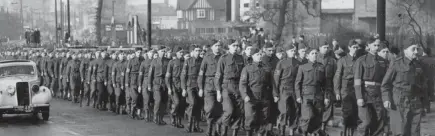  ?? ?? Top, Members of Derby Home Guard carry out PT on an overgrown Baseball Ground pitch in 1940.
Above, Home Guard on parade in Derby before inspection by Brigadier General Walthall on November 25, 1940. Left, Derby Home Guard members . Bottom left, recruiting at Becket Street Drill Hall. Below centre, Brigadier General Walthall inspects members of the Derby Cable Works Home Guard. Below, rifle instructio­ns at Becket Street Drill Hall.