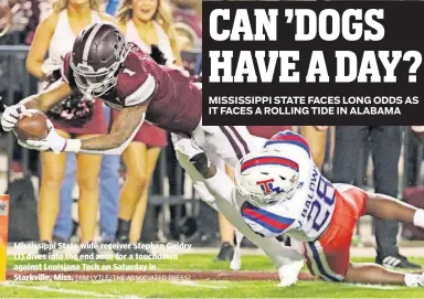  ?? [JIM LYTLE/THE ASSOCIATED PRESS] ?? Mississipp­i State wide receiver Stephen Guidry (1) dives into the end zone for a touchdown against Louisiana Tech on Saturday in Starkville, Miss.