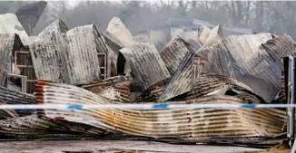  ??  ?? The equestrian centre: It keeps about 70 horses Destroyed: The blackened remains of the burnt-out barn yesterday