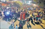  ?? ANI ?? Protesters gather around a replica of the India Gate set up at Shaheen Bagh in New Delhi, on Tuesday.