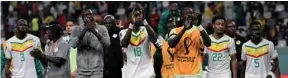  ?? ?? Senegal’s forward Ismaila Sarr (centre) celebrates with teammates after the team won the Qatar 2022 World Cup Group A football match against Ecuador at the Khalifa Internatio­nal Stadium in Doha yesterday.