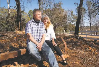  ??  ?? Pam and Bill Hartley at their new property in Paradise. Their old home burned in the blaze two years ago, and they rebuilt in a new location. “It feels like a lifetime sometimes,” Pam says.