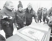  ?? CANADIAN PRESS FILE PHOTO ?? The family of one of 16 people killed in a crash involving the Humboldt Broncos filed a lawsuit. Adam Herold’s father, Russell; mother, Raelene; and sister Erin are pictured here celebratin­g what would have been Adam’s 17th birthday April 12.