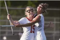  ?? Dave Stewart / Hearst Connecticu­t Media ?? New Canaan’s Caitlin Tully (15) and Stella Nolan celebrate after Tully scored during the first half of the FCIAC girls lacrosse final against Darien in Norwalk on May 25.