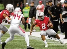  ?? DAVID JABLONSKI / STAFF ?? Ohio State’s J.K. Dobbins rushed for 73 yards and touchdown on 12 carries against Rutgers on Saturday.