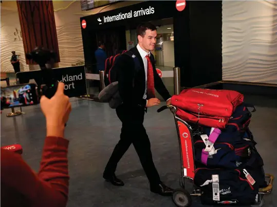  ?? STEPHEN McCARTHY/SPORTSFILE ?? Johnny Sexton arrives in Auckland Airport yesterday along with his Lions team-mates hours before being named in the starting team for Saturday’s game against the New Zealand Provinical XV. Sexton is one of three Irish men on the team with Rory Best and...