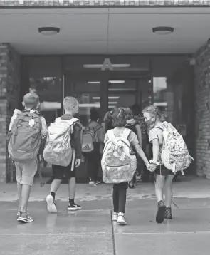  ?? COURTNEY HERGESHEIM­ER/COLUMBUS DISPATCH ?? Ohio Republican­s are proposing a "backpack voucher" program where every K-12 student, regardless of family income or school attended, could get up to $7,500 to spend on private school tuition.