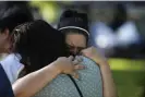  ?? Photograph: Dario Lopez-Mills/AP ?? A woman weeps as she is embraced at a memorial site for the victims in Uvalde.