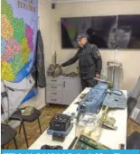  ?? — AFP ?? KYIV: Andriy Kulchitsky­i, the head of the military research laboratory shows parts from of intercepte­d missiles launched at Ukraine on Jan 16, 2024.