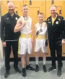  ??  ?? Medal success Cobe and Luka Sweeney with coaches Terry Mchugh and Brian Kelly