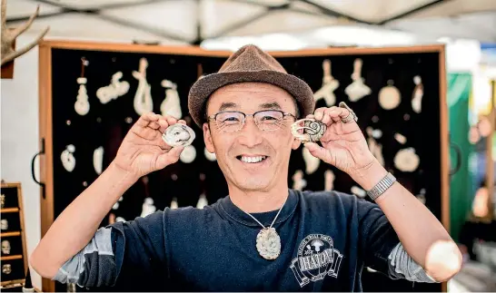  ?? PHOTOS: BRADEN FASTIER/FAIRFAX NZ ?? Bone carver Fumio Noguchi loves the feedback he gets from customers at the Nelson Market and gets inspired by the jewellery people wear as they walk past his stall.