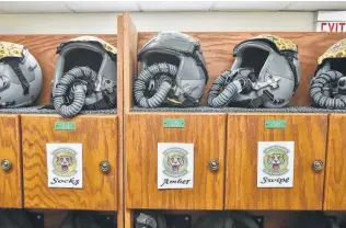  ?? Robin Jerstad / Contributo­r ?? Helmets wait to be worn during training flights at Joint Base San Antonio-Randolph.