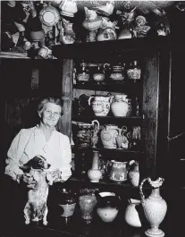  ?? CONTRIBUTE­D PHOTO ?? Anna Safley Houston poses with her dog, Sonny, in her shop.