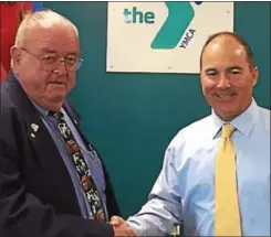  ?? PHOTO COURTESY ONEIDA FAMILY YMCA ?? Assemblyma­n William Magee, left, hands a check to Hank Leo, CEO of the Oneida Family YMCA.