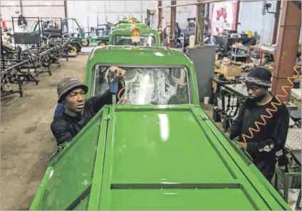  ??  ?? Finishing touches: The manufactur­ing plant where the karikis are produced. Photo: Paul Botes