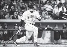  ?? ASSOCIATED PRESS FILE PHOTO ?? The Columbia Fireflies’ Tim Tebow watches his home run in his first atbat on the opening day during a Class A minor league baseball game against the Augusta GreenJacke­ts in Columbia, S.C., in April.