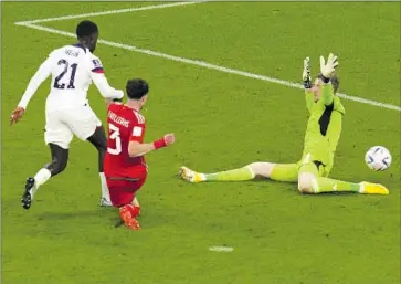  ?? Themba Hadebe Associated Press ?? TIM WEAH puts the ball past Wales goalkeeper Wayne Hennessey in the 36th minute. The U.S. dominated the first half before fatigue set in and halftime adjustment­s allowed Wales to control the final 45-plus minutes.