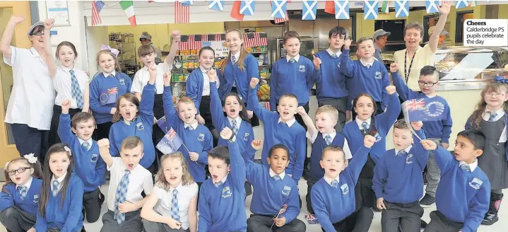  ??  ?? Cheers Calderbrid­ge PS pupils celebrate the day