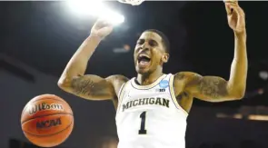  ?? JAMIE SQUIRE/ GETTY IMAGES ?? Michigan guard Charles Matthews, who graduated from St. Rita, said Loyola’s tournament run has been great for Chicago, and he’s ecstatic for the Ramblers as a product of Chicago.