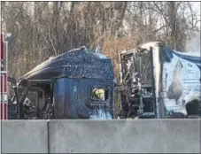  ?? PETE BANNAN – DIGITAL FIRST MEDIA ?? The burned out cab of a tractor-trailer that shut down the eastbound lanes on the Pennsylvan­ia Turnpike Monday morning.