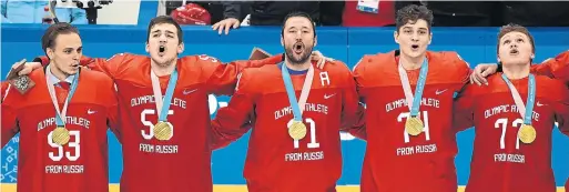  ?? HARRY HOW GETTY IMAGES FILE PHOTO ?? A ban on the Russian anthem at the Pyeonchang Olympics didn’t stop Ilya Kovachuk, centre, and his teammates from singing it after winning gold.