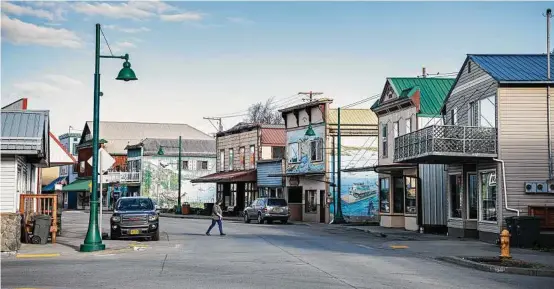  ??  ?? A quiet morning on Front Street in downtown Wrangell, Alaska. Much of Wrangell looks unchanged from the late 1800s. The supermarke­ts are closed on Sunday and an Elks Lodge anchors the busiest intersecti­on.